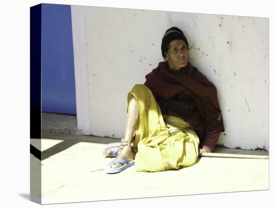Old Woman Sitting Against a Wall, Nepal-David D'angelo-Stretched Canvas