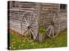 Old Wooden Barn with Wagon Wheels in Rural New England, Maine, USA-Joanne Wells-Stretched Canvas