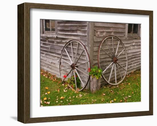 Old Wooden Barn with Wagon Wheels in Rural New England, Maine, USA-Joanne Wells-Framed Premium Photographic Print