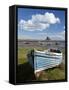 Old Wooden Fishing Boat on a Grassy Bank with Lindisfarne Harbour and Lindisfarne Castle, Holy Isla-Lee Frost-Framed Stretched Canvas