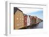 Old wooden warehouses on the Nidelva River in Trondheim, Trondelag-Ellen Rooney-Framed Photographic Print