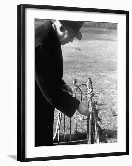 Older Man Feeding Birds Perched on a Fence in Hyde Park-Cornell Capa-Framed Photographic Print