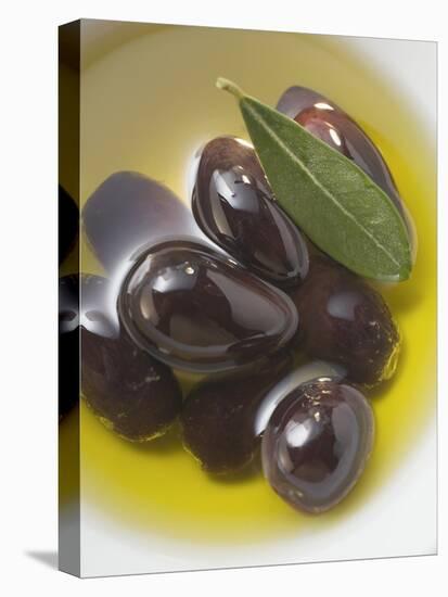 Olive Oil, Black Olives and Olive Leaf in Bowl-null-Stretched Canvas