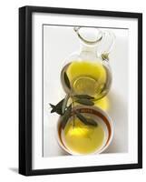 Olive Oil with Olive Branch in Bowl in Front of Carafe-null-Framed Photographic Print