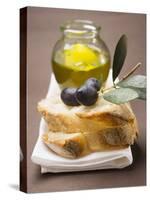 Olive Sprig with Black Olives on White Bread, Olive Oil Behind-null-Stretched Canvas