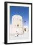 Oman, Sur. Omani Man Walking to the Entrance of Sunaysilah Old Fortress-Matteo Colombo-Framed Photographic Print