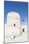 Oman, Sur. Omani Man Walking to the Entrance of Sunaysilah Old Fortress-Matteo Colombo-Mounted Photographic Print