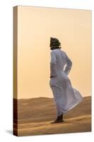 Oman, Wahiba Sands. an Omani Guide Enjoys the Sunset on Sand Dunes in Wahiba Sands.-Nigel Pavitt-Stretched Canvas