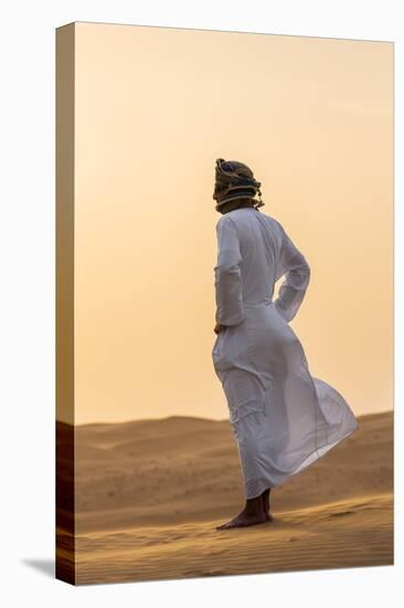 Oman, Wahiba Sands. an Omani Guide Enjoys the Sunset on Sand Dunes in Wahiba Sands.-Nigel Pavitt-Stretched Canvas