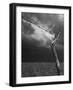 On a Small Farm, Ominous Clouds Overhead, Outlined by Barbed Wire Fencing-Nat Farbman-Framed Photographic Print