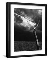 On a Small Farm, Ominous Clouds Overhead, Outlined by Barbed Wire Fencing-Nat Farbman-Framed Photographic Print