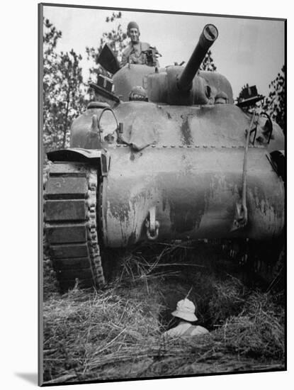 Oncoming View of Tank About to Pass over Foxhole in Which a Soldier is Crouched Down-Myron Davis-Mounted Photographic Print