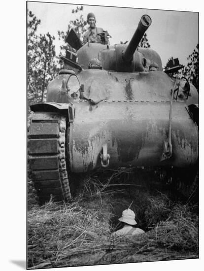 Oncoming View of Tank About to Pass over Foxhole in Which a Soldier is Crouched Down-Myron Davis-Mounted Photographic Print