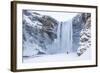 One Person in Red Jacket Walking in the Snow Towards Skogafoss Waterfall in Winter-Neale Clark-Framed Photographic Print