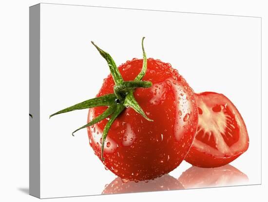 One Whole and One Halved Tomato with Drops of Water-Michael Löffler-Stretched Canvas
