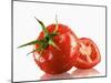 One Whole and One Halved Tomato with Drops of Water-Michael Löffler-Mounted Photographic Print