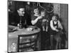 One Year Old Baby Boy Gets a Drink of Coca Cola in Front of the Christmas Tree, Ca. 1946-null-Mounted Photographic Print