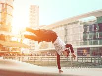 Extreme Parkour in Business Center. Young Boy Performing Some Jumps from Parkour Discipline-Oneinchpunch-Photographic Print