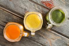 Colorful Trio of Fresh Fruit Juice in Glass Jugs-oocoskun-Photographic Print