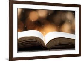 Open Book on Wooden Table with Bokeh Effect in the Background-Chris_Elwell-Framed Photographic Print