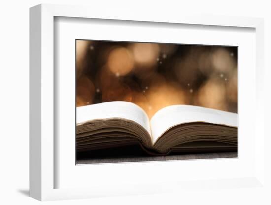 Open Book on Wooden Table with Bokeh Effect in the Background-Chris_Elwell-Framed Photographic Print