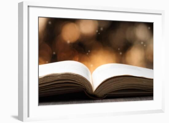 Open Book on Wooden Table with Bokeh Effect in the Background-Chris_Elwell-Framed Photographic Print