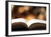 Open Book on Wooden Table with Bokeh Effect in the Background-Chris_Elwell-Framed Photographic Print