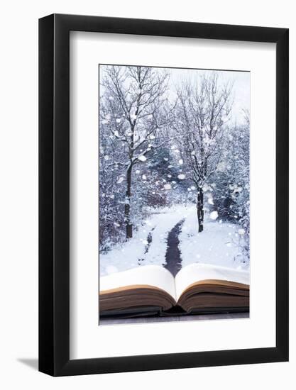 Open Book with Winter Woodland Background and falling Snow-Chris_Elwell-Framed Photographic Print