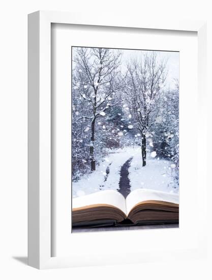 Open Book with Winter Woodland Background and falling Snow-Chris_Elwell-Framed Photographic Print