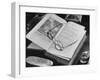 Open Pages of an Old Book, Held Down by a Pair of Steel-Rimmed Spectacles at Mt. Pleasant-null-Framed Photographic Print