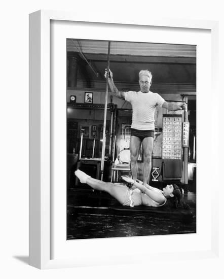 Opera Singer Roberta Peters Balancing Her Trainer, Joseph Pilates, on Her Operatic Breadbasket-Michael Rougier-Framed Premium Photographic Print