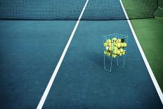 Tennis Court with Tennis Balls in Tennis Ball Basket Stand. Intentionally Shot in Surreal Tone.-optimarc-Laminated Photographic Print