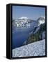 OR, Crater Lake NP. Evening light warms snowy rim of Crater Lake in late afternoon-John Barger-Framed Stretched Canvas