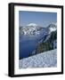 OR, Crater Lake NP. Evening light warms snowy rim of Crater Lake in late afternoon-John Barger-Framed Photographic Print