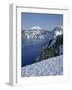 OR, Crater Lake NP. Evening light warms snowy rim of Crater Lake in late afternoon-John Barger-Framed Photographic Print