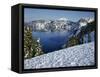 OR, Crater Lake NP. Evening light warms snowy rim of Crater Lake in late afternoon-John Barger-Framed Stretched Canvas