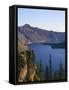 OR, Crater Lake NP. Sunrise on west rim of Crater Lake with Hillman Peak overlooking Wizard Island.-John Barger-Framed Stretched Canvas