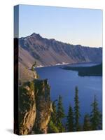 OR, Crater Lake NP. Sunrise on west rim of Crater Lake with Hillman Peak overlooking Wizard Island.-John Barger-Stretched Canvas