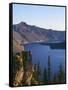 OR, Crater Lake NP. Sunrise on west rim of Crater Lake with Hillman Peak overlooking Wizard Island.-John Barger-Framed Stretched Canvas