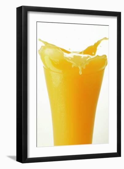 Orange Juice Splashing Out of Glass-Foodcollection-Framed Photographic Print