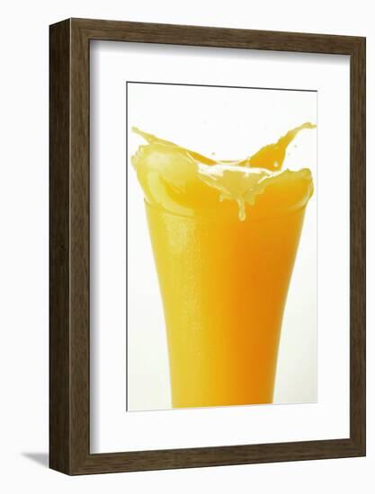 Orange Juice Splashing Out of Glass-Foodcollection-Framed Photographic Print