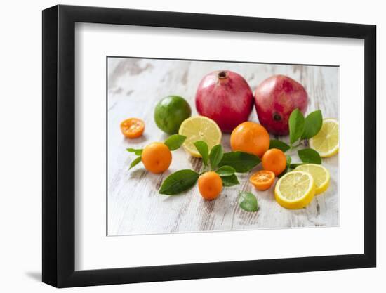 Oranges, Limes, Lemons, Clementines and Pomegranates on White Wooden Table-Jana Ihle-Framed Photographic Print