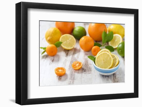 Oranges, Limes, Lemons, Clementines on White Wooden Table-Jana Ihle-Framed Photographic Print