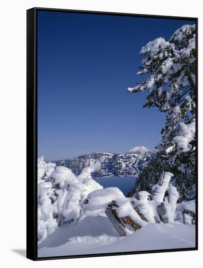 Oregon, Crater Lake National Park. Winter snow accumulates at Crater Lake-John Barger-Framed Stretched Canvas