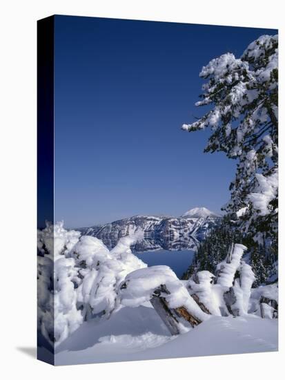 Oregon, Crater Lake National Park. Winter snow accumulates at Crater Lake-John Barger-Stretched Canvas