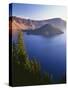 Oregon, Crater Lake NP. Sunrise on west rim of Crater Lake with Wizard Island and distant Llao Rock-John Barger-Stretched Canvas