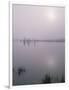 Oregon. Deschutes NF, early morning sun breaks through fog over Crane Prairie Reservoir.-John Barger-Framed Photographic Print