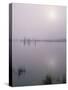 Oregon. Deschutes NF, early morning sun breaks through fog over Crane Prairie Reservoir.-John Barger-Stretched Canvas