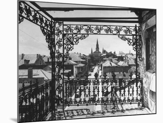 Orleans Street, Center of Old French Quarter of City, Through Grillwork of a Balcony-Andreas Feininger-Mounted Photographic Print