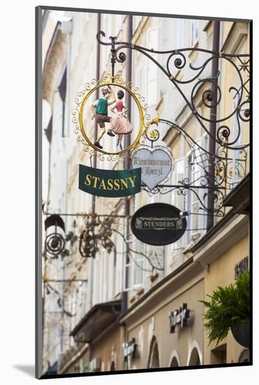 Ornate Shop Signs on Getreidegasse, Salzburgs Bustling Shopping Street, Salzburg-Doug Pearson-Mounted Photographic Print